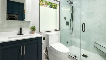 Bathtub, hair dryer, towels, soap