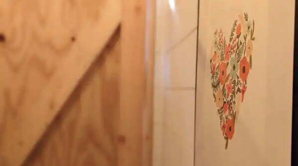 A wooden wall with a floral pattern.