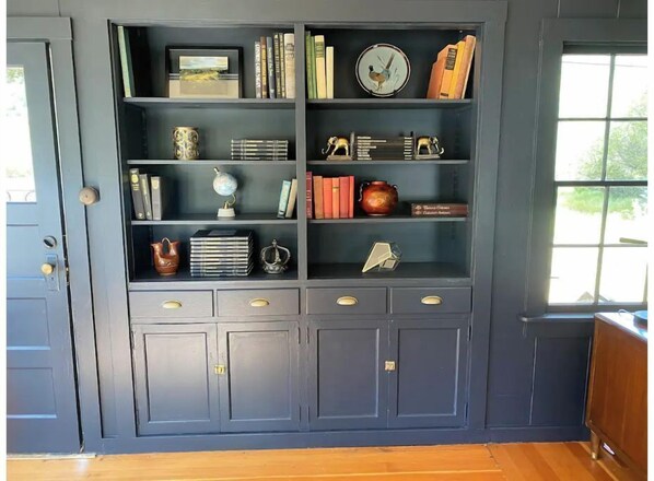 Cozy retreat with a bookshelf and comfortable seating area.