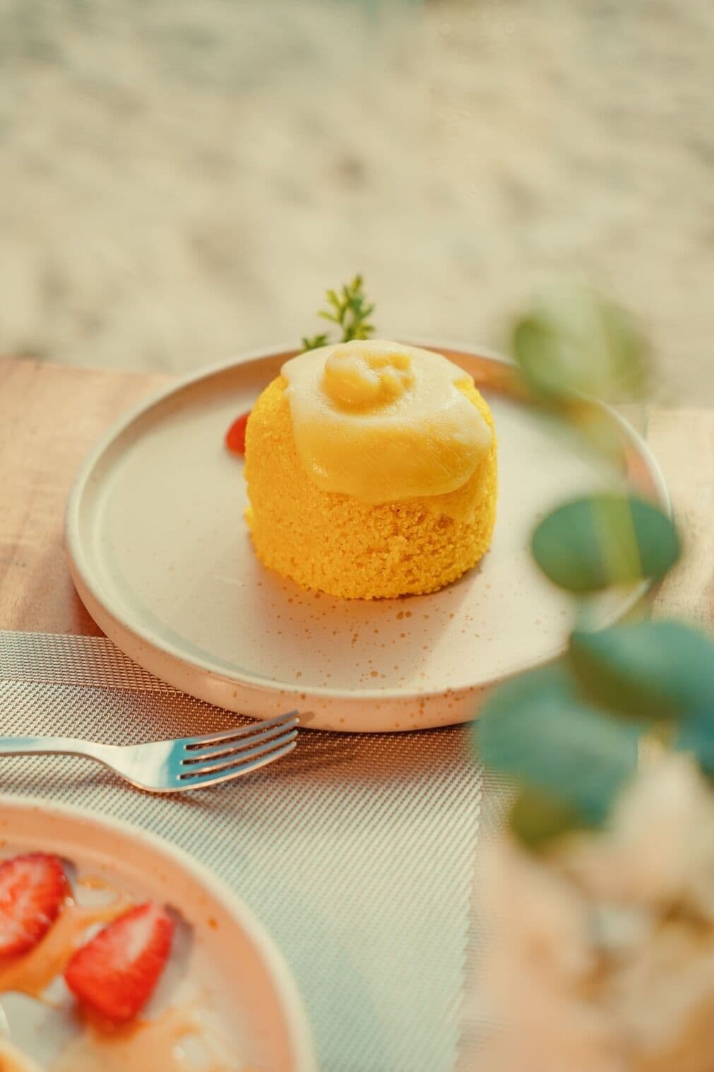 A dessert on a plate with a fork beside it.