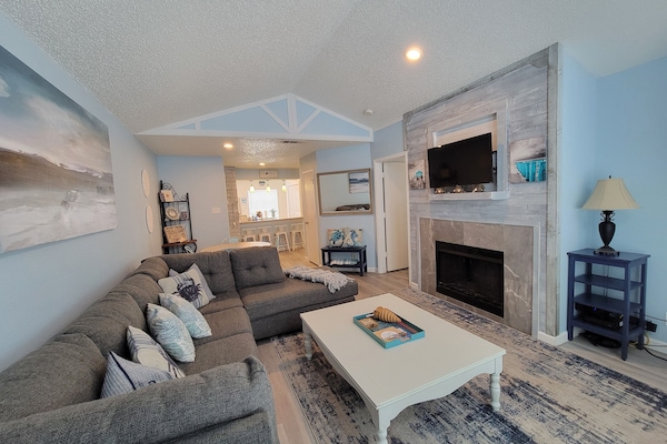 Living Room has large sectional and TV