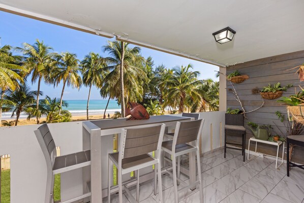 Outdoor dining - PLAYA AZUL1 2ND FLOOR BEACHFRONT LUX  DESIGNER CONDO. (Luquillo)