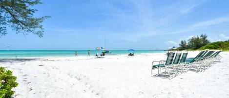 On the beach, sun-loungers, beach towels