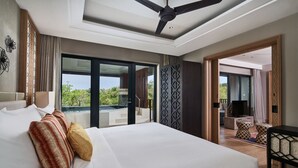 A spacious bedroom with a large bed, a ceiling fan, and a view of the outdoors. - Marriott's Bali Nusa Dua Terrace (Nusa Dua)