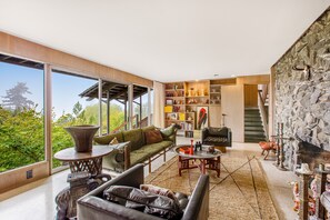 TV, fireplace, books, streaming services - Spectacular mid-century home with two-story fireplace, huge deck, & water views (Shoreline)