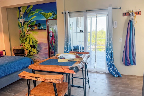 Sunrise King Suite 360 degree views of island from roof top | Living area | 43-inch flat-screen TV with digital channels, Netflix