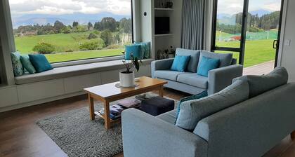 Beautiful new home with spectacular water and mountain views .