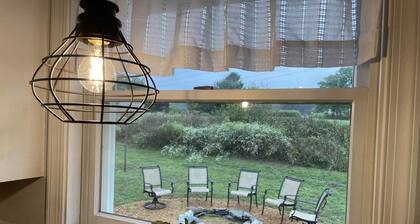 Remodeled country home in neighborhood with Amish farms, fire pit in back yard