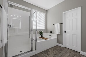 Combined shower/tub, hair dryer, towels, toilet paper