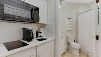 Combined shower/bathtub, towels, soap, toilet paper