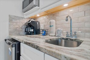 Fridge, microwave, coffee/tea maker, toaster