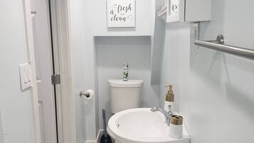 Shower, towels, soap, toilet paper