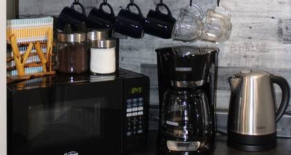 Kitchenette Suite with King & Queen beds, Quiet Forest views from patio with BBQ