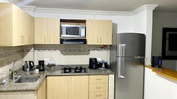 Microwave, stovetop, coffee/tea maker, electric kettle