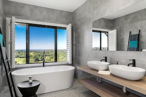 Bathtub, hair dryer, towels, soap