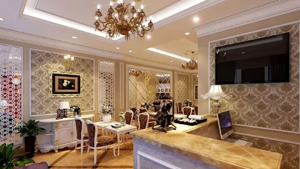 A spacious lobby with a marble floor, a reception desk, a chandelier, and a large TV screen. - Cristina Boutique Hotel (Hanoi)