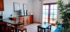 Superior Apartment, 1 Bedroom, Sea View | Living area | 32-inch TV with digital channels