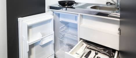 Fridge, microwave, electric kettle, cookware/dishes/utensils