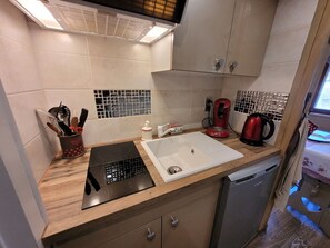 Fridge, microwave, toaster, dining tables