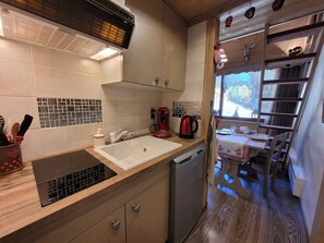 Fridge, microwave, toaster, dining tables