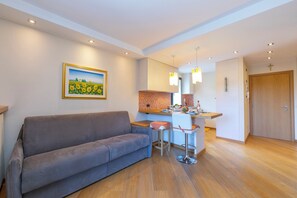 Family Apartment, Multiple Bedrooms (Ermellino Ski in - Ski out 150m) | Living room | 21-inch flat-screen TV with satellite channels, TV - Ermellino Ski in - Ski out 150m (Livigno)