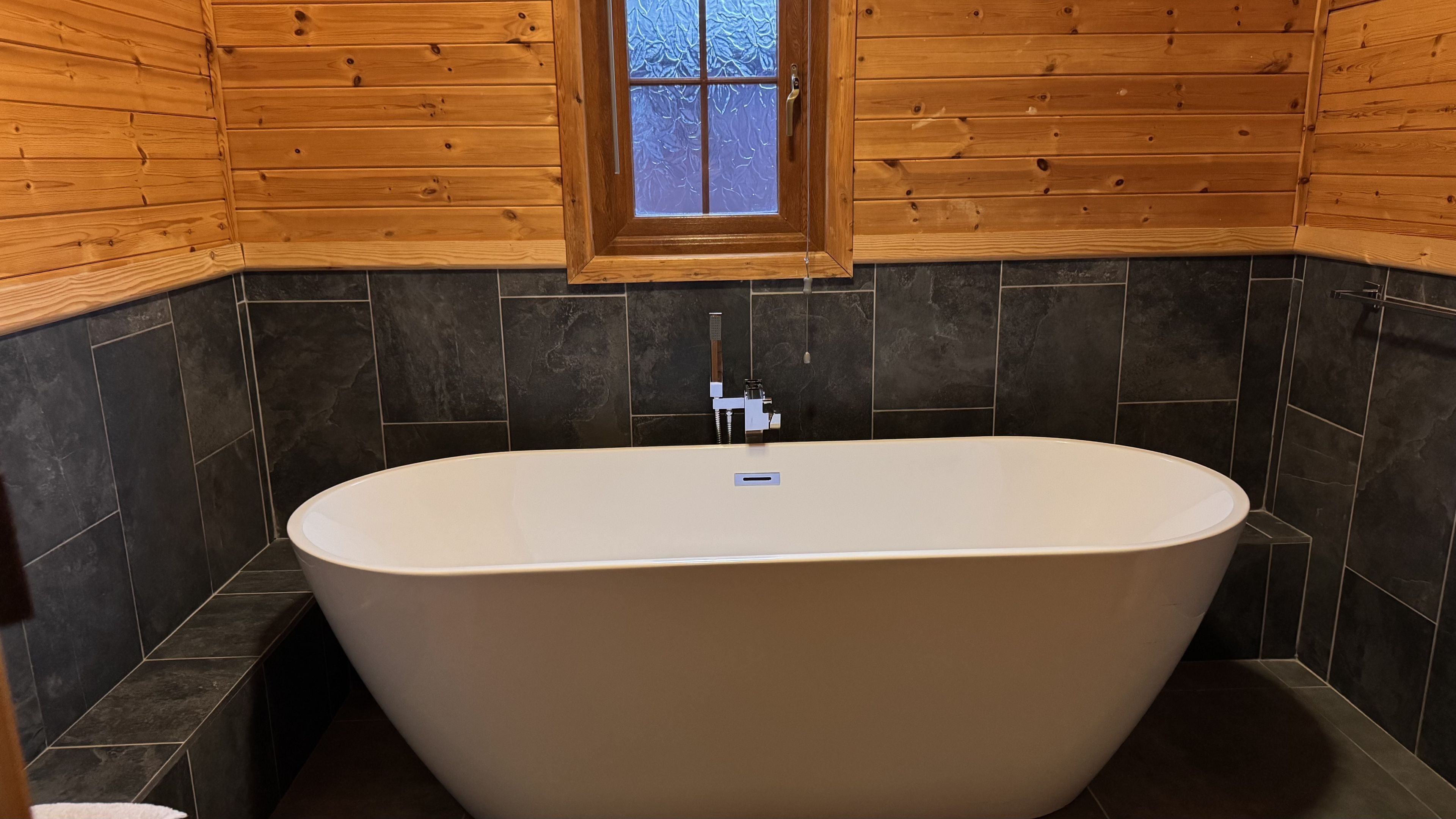 Bathtub, hair dryer, towels