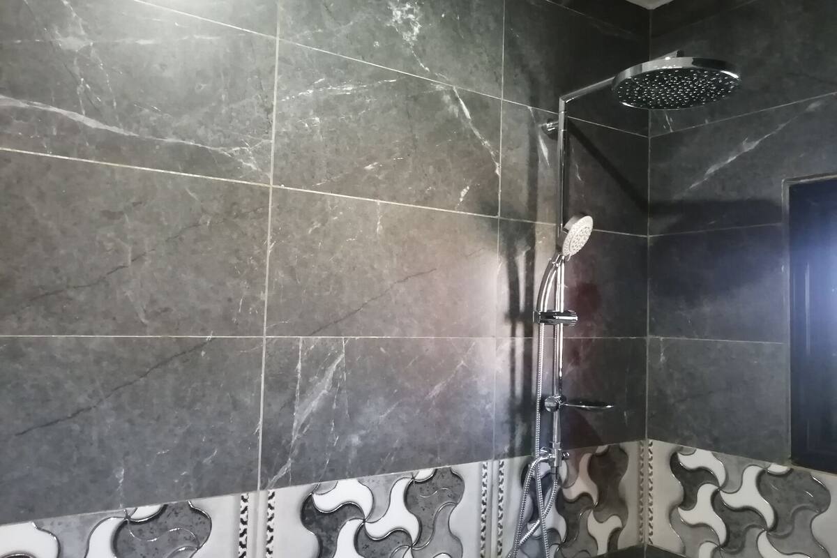 standard double room single use | bathroom | shower, rainfall showerhead, free toiletries, towels