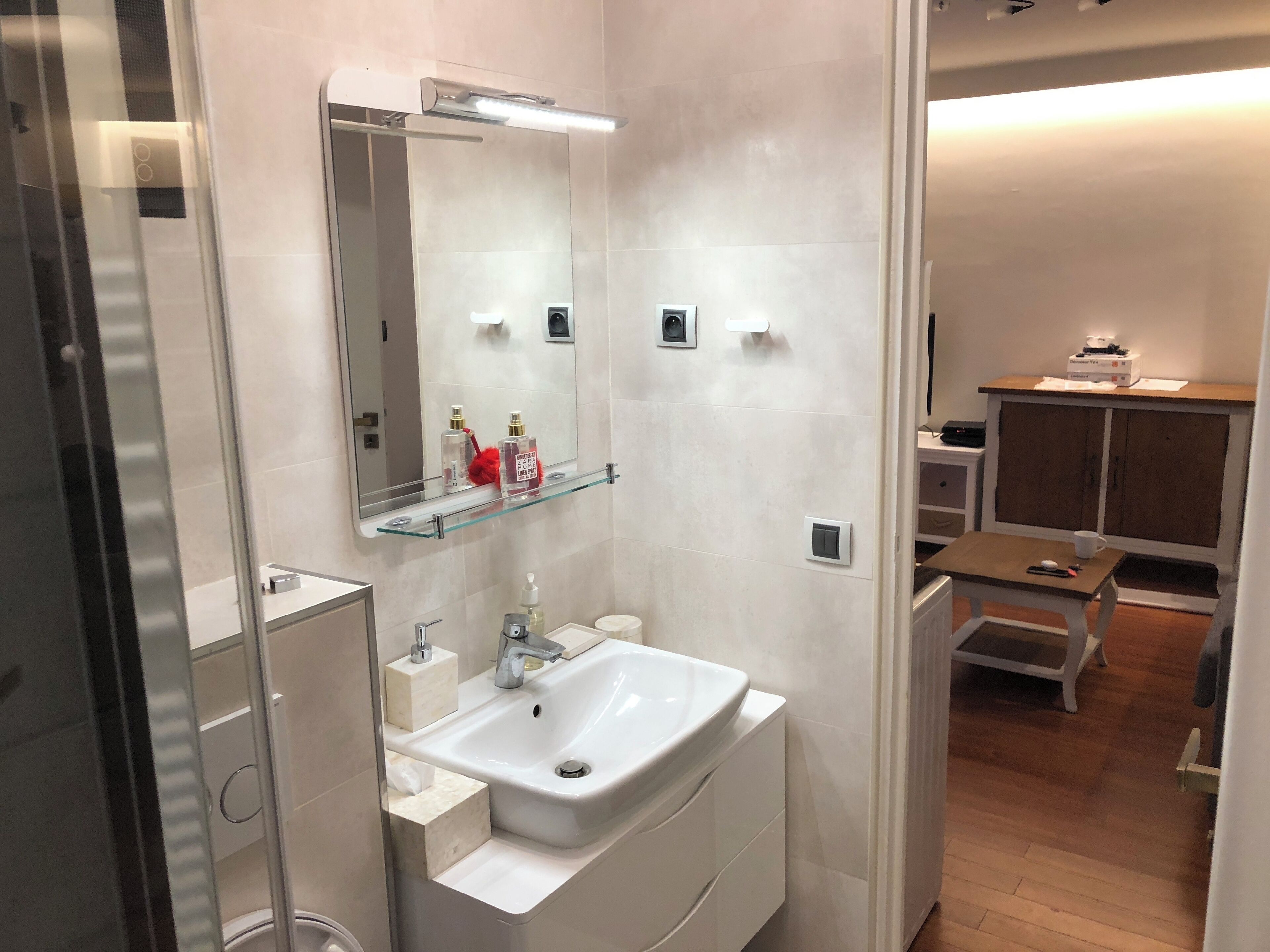 Shower, hair dryer, towels, toilet paper