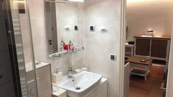 Shower, hair dryer, towels, toilet paper