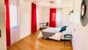 Laptop workspace, bed sheets