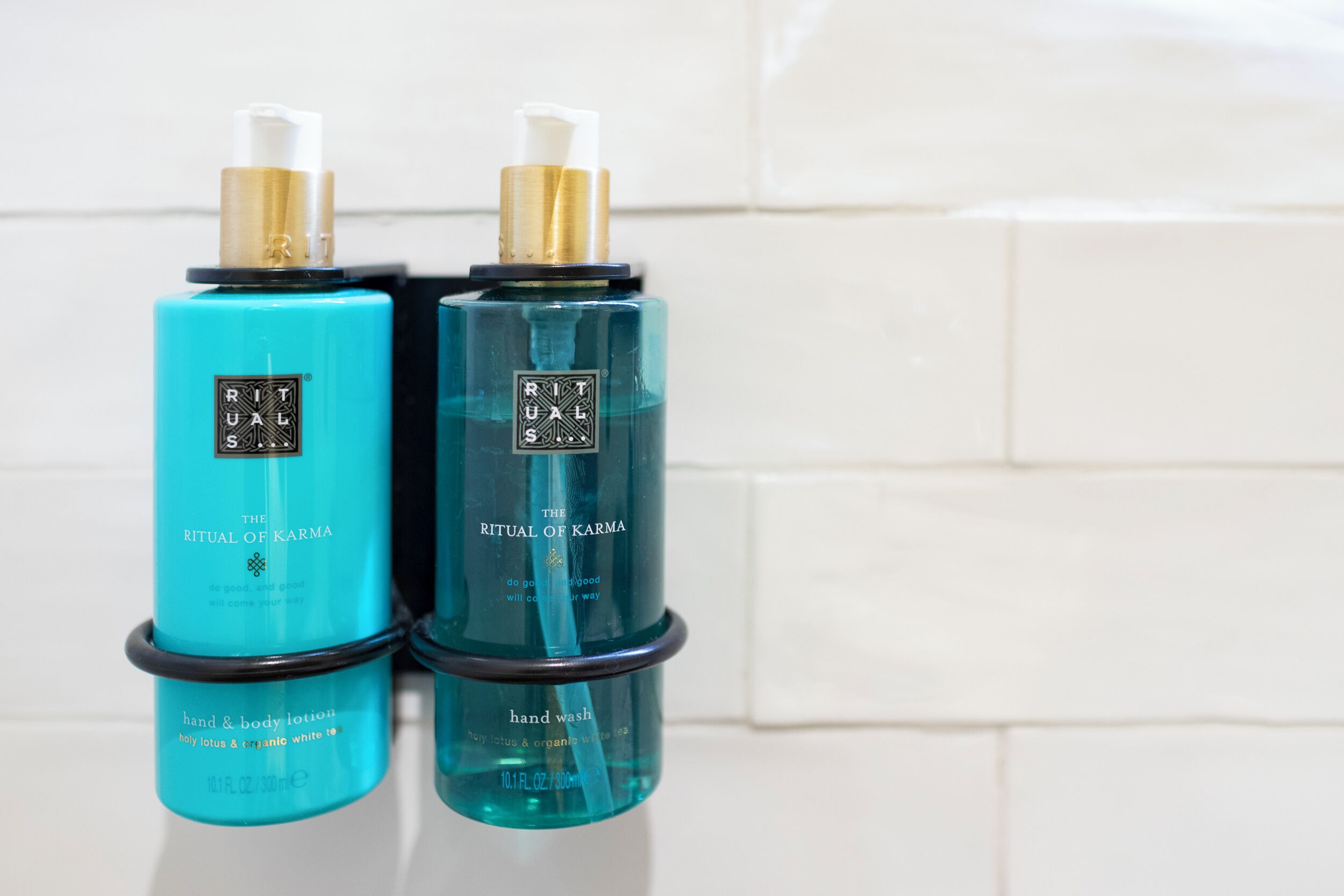 Two bottles of hand and body lotion and hand wash.