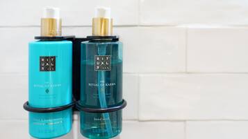 Two bottles of hand and body lotion and hand wash.