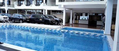 2 outdoor pools, open 9:00 AM to 9:00 PM, lifeguards on site