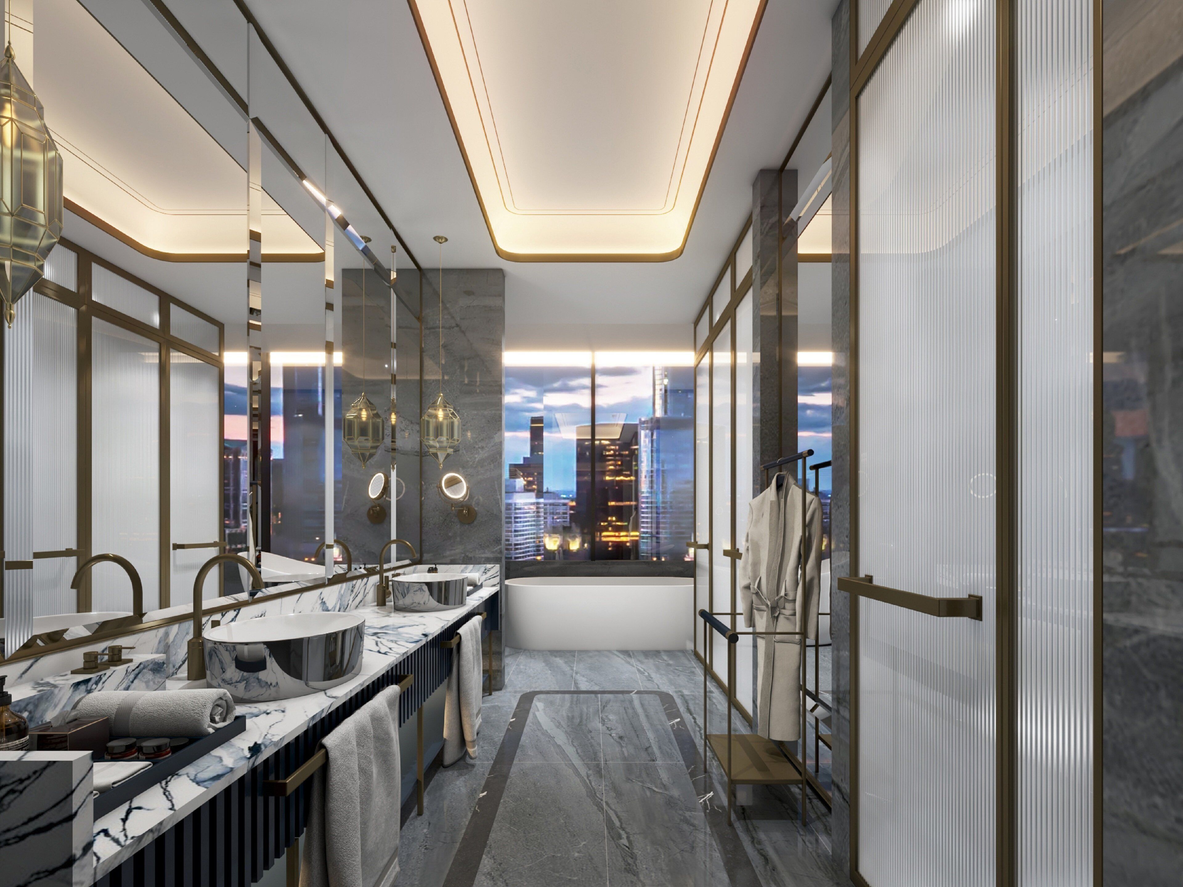 Un baño moderno con tocador de mármol, un espejo grande y vistas a un paisaje urbano.