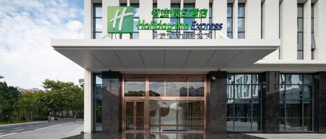 A modern building with a Holiday Inn Express sign.
