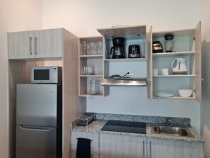 Fridge, microwave, stovetop, coffee/tea maker