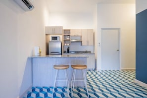 Fridge, microwave, stovetop, coffee/tea maker