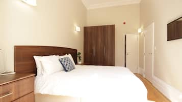 1 bedroom, desk, iron/ironing board, travel crib