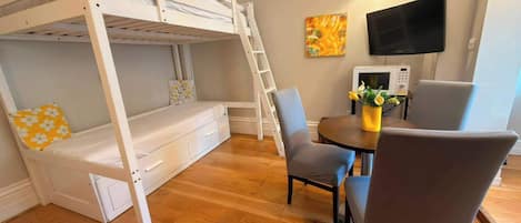 1 bedroom, desk, iron/ironing board, travel crib