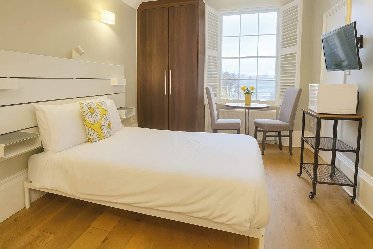 1 bedroom, desk, iron/ironing board, travel crib