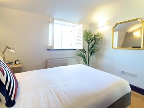 1 bedroom, desk, iron/ironing board, travel crib