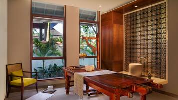 Enjoy meals at the dining table with a view of lush tropical vegetation.