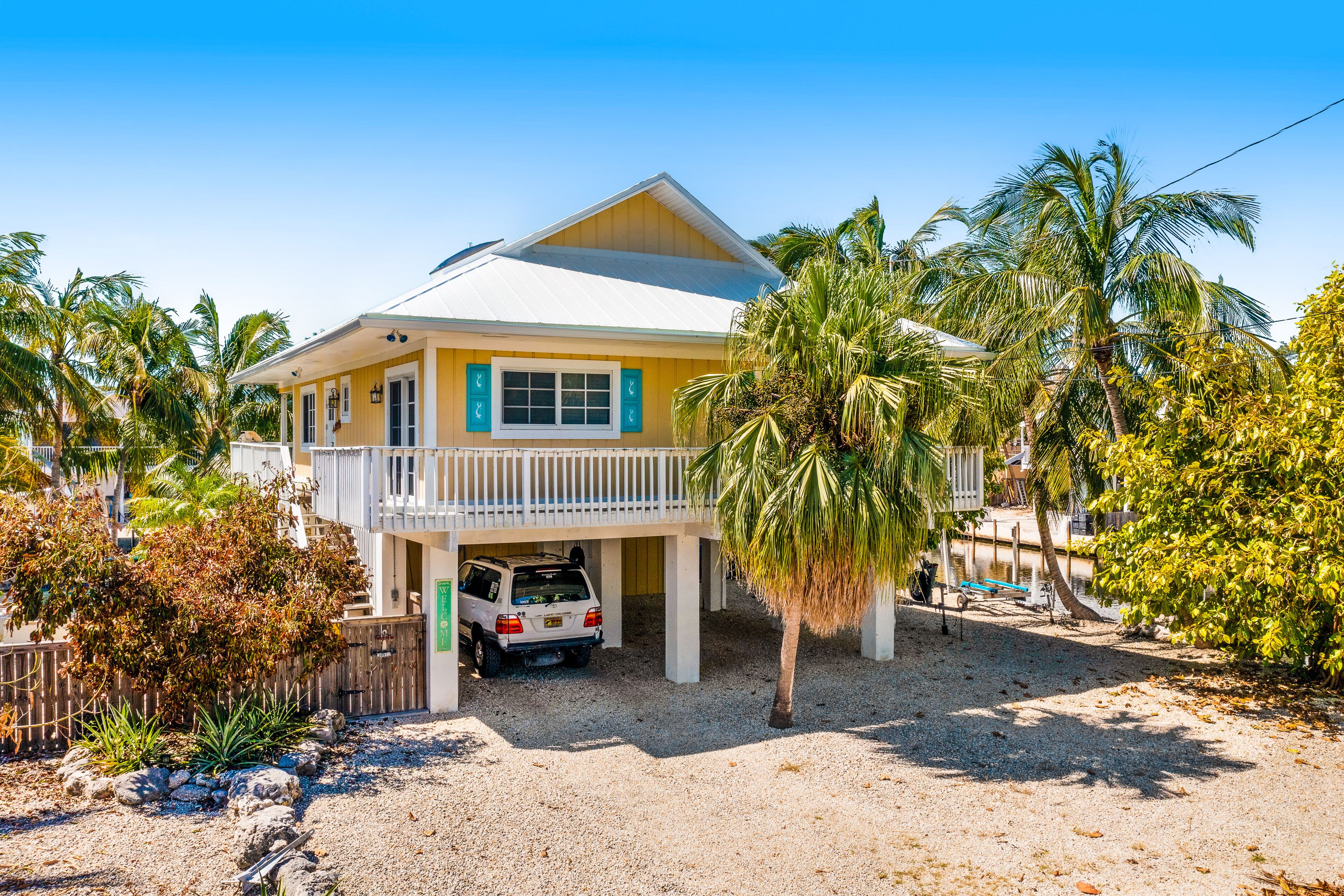 Dog-friendly, waterfront retreat with a Bohemian vibe, pool, bar, & firepit