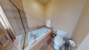 Bathtub, hair dryer, towels, soap