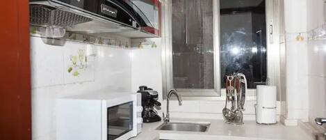 Fridge, microwave, stovetop, coffee/tea maker