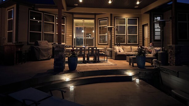 A covered outdoor patio area with a dining table, chairs, and a sofa. - Hot Tub + 1,600 sq ft Golf-Course Patio • Game Room & Luxury Living (Billings)