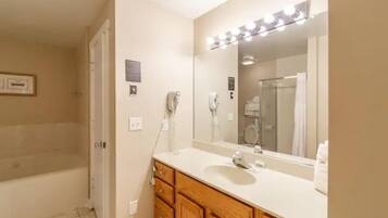 Combined shower/tub, hair dryer, towels, soap