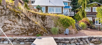 Lovely lakefront home with fireplace, dock, full kitchen, & washer/dryer