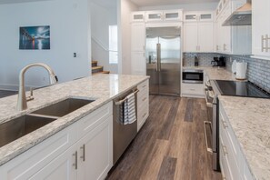 Fridge, microwave, oven, stovetop - Luxury Waterfront Estate—Pool, Spa, Game Lounge, 2 Docks & Ramp Access—Gulfside (Marathon)