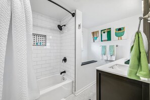 Combined shower/tub, hair dryer, towels, soap